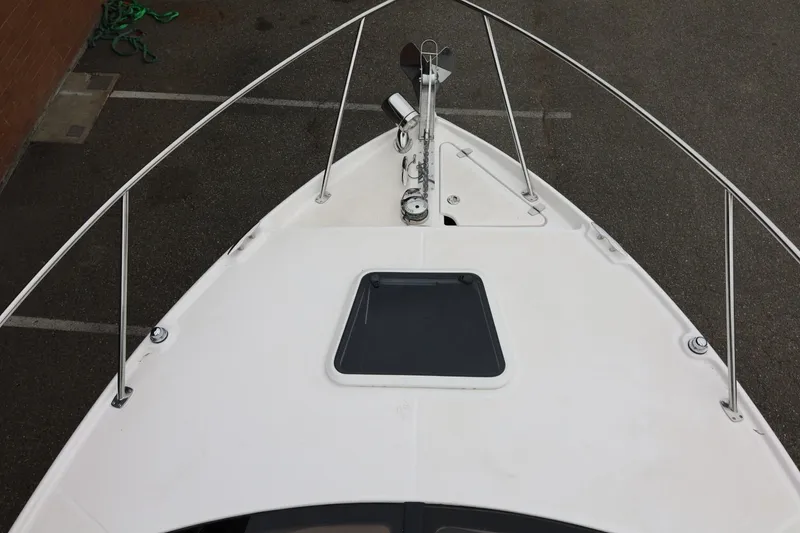 Slide: The Image of Bow view of 2014 Regal 30 Express boat with anchor and hatch. - 70