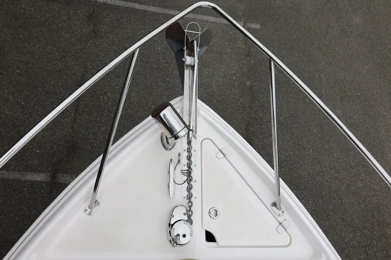 Slide: The Image of Bow view of 2014 Regal 30 Express boat with anchor and railing. - 71