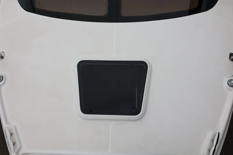 Slide: The Image of 2014 Regal 30 Express boat deck with a closed hatch. - 73