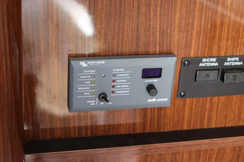 Slide: The Image of Control panel on 2014 Regal 30 Express boat with Victron Energy charger and inverter. - 93