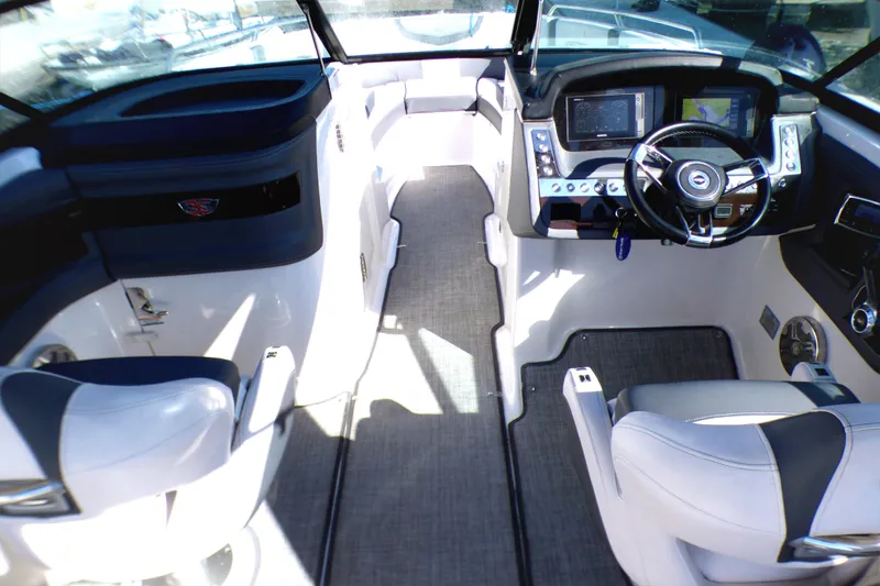 Slide: The Image of 2018 Chaparral 267 SSX boat interior with modern dashboard and seating. - 12