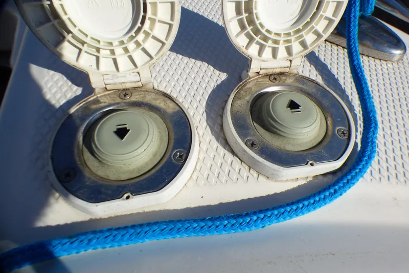 Slide: The Image of Fuel caps on a 2018 Chaparral 267 SSX boat with blue rope detail. - 26