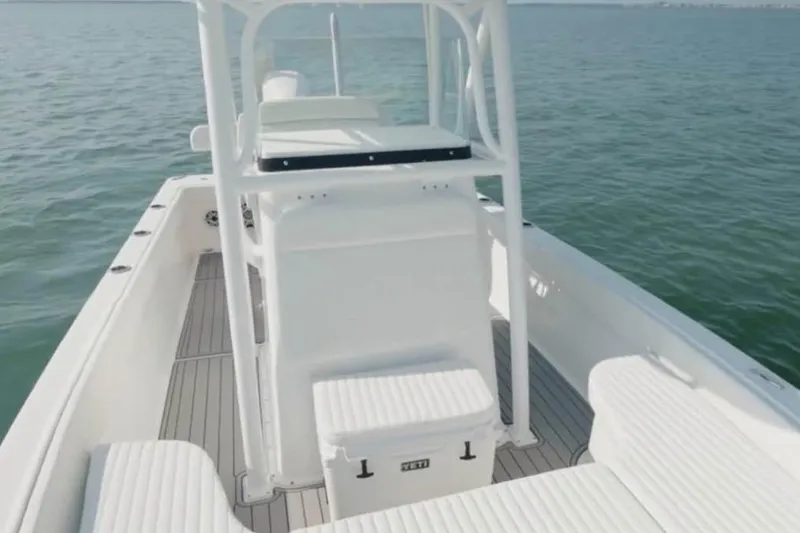 Slide: The Image of 2021 Canyon Bay 24H boat interior with seating and ocean view. - 12