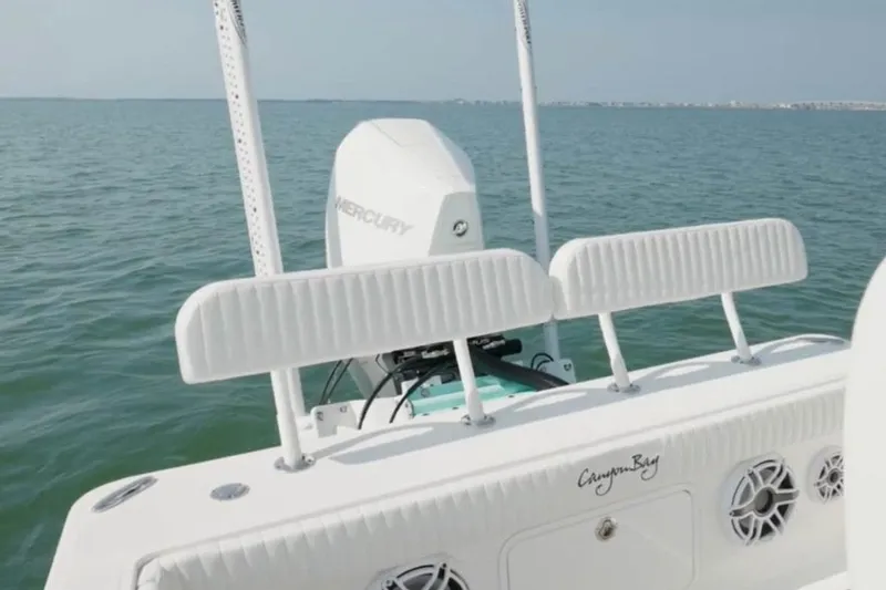 Slide: The Image of 2021 Canyon Bay 24H boat with Mercury engine on open water. - 13