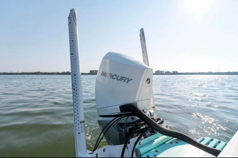 Slide: The Image of Canyon Bay 24H boat with Mercury engine on calm water, 2021 model. - 7