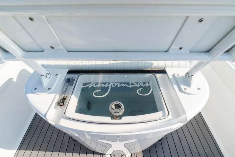 Slide: The Image of 2021 Canyon Bay 24H boat interior with storage compartment and sleek design. - 9