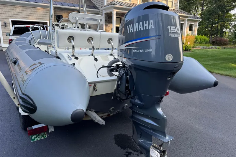 Slide: The Image of 2010 Zodiac Pro Open 650 boat with Yamaha 150 four-stroke engine on driveway. - 13