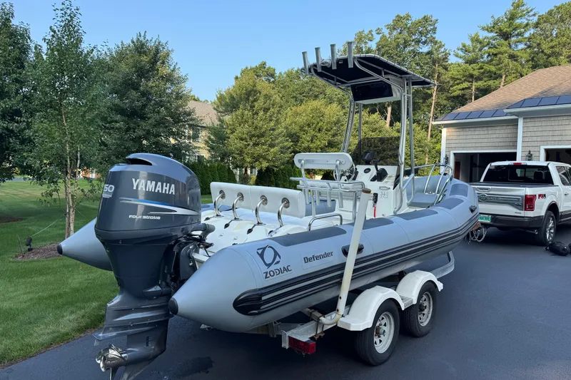 Slide: The Image of 2010 Zodiac Pro Open 650 boat with Yamaha engine on trailer in driveway. - 2