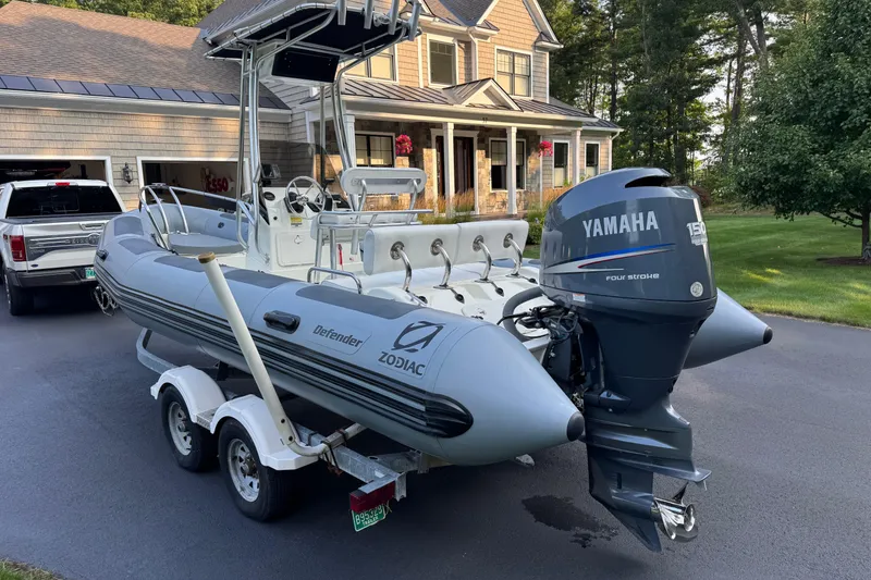Slide: The Image of 2010 Zodiac Pro Open 650 boat with Yamaha engine on trailer in driveway. - 3