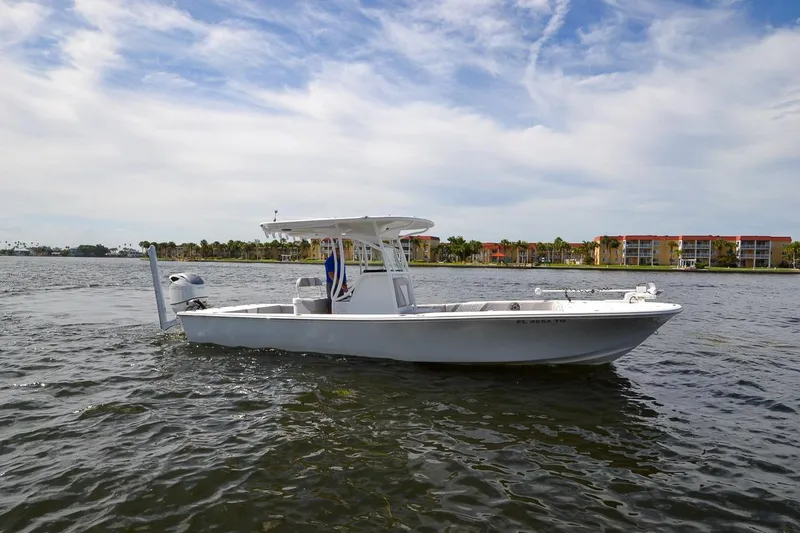 Slide: The Image of 2020 Canyon Bay 28h boat on water with scenic background. - 16
