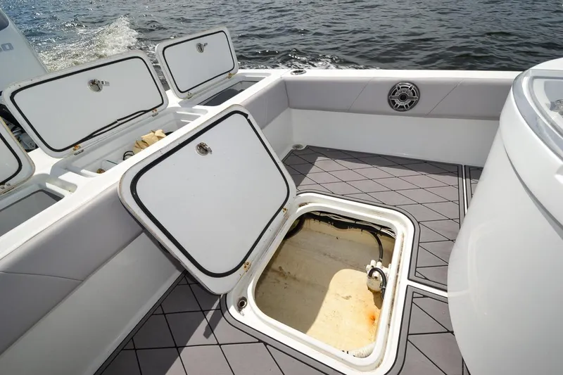 Slide: The Image of Canyon Bay 28h 2020 boat with open storage compartments on deck. - 46