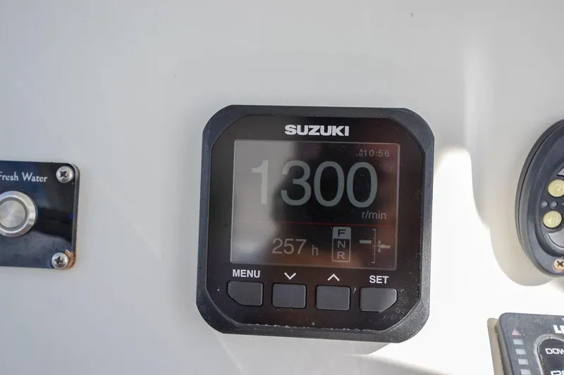 Slide: The Image of Suzuki digital display on 2020 Canyon Bay 28h boat showing 1300 RPM. - 47