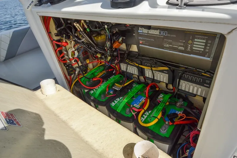 Slide: The Image of 2020 Canyon Bay 28h boat battery compartment with wiring and ProTournament charger. - 49