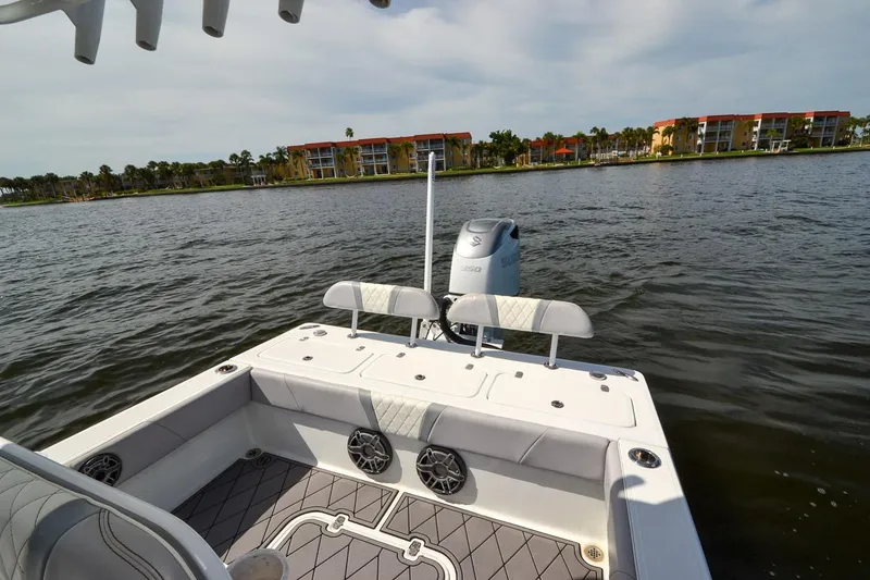 Slide: The Image of 2020 Canyon Bay 28h boat on water, featuring spacious deck and modern design. - 5