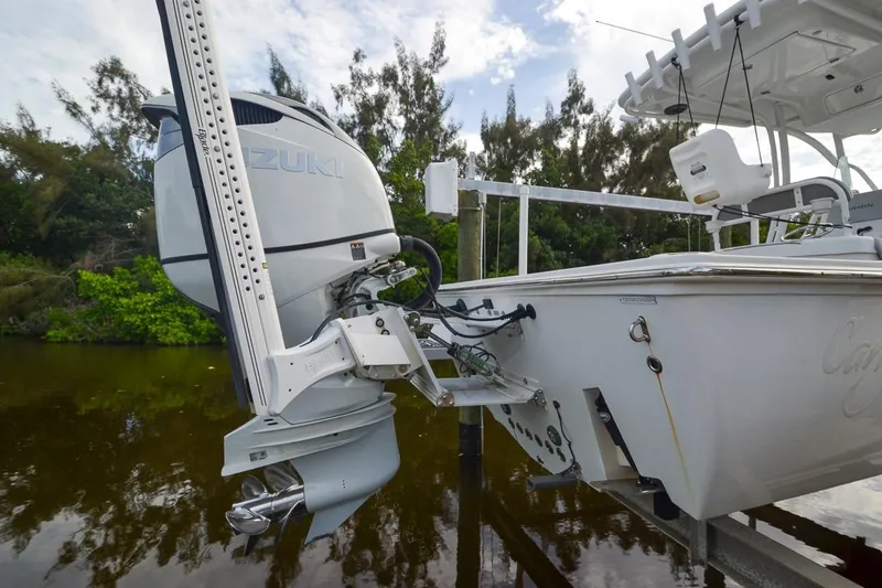 Slide: The Image of 2020 Canyon Bay 28h boat with Suzuki outboard motor on a lift. - 7