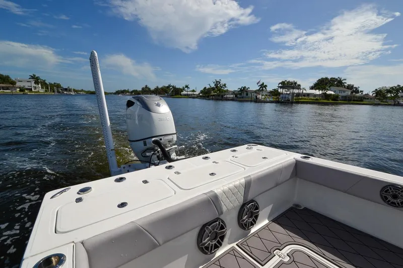Slide: The Image of 2020 Canyon Bay 28h boat on a scenic waterway with clear skies. - 9