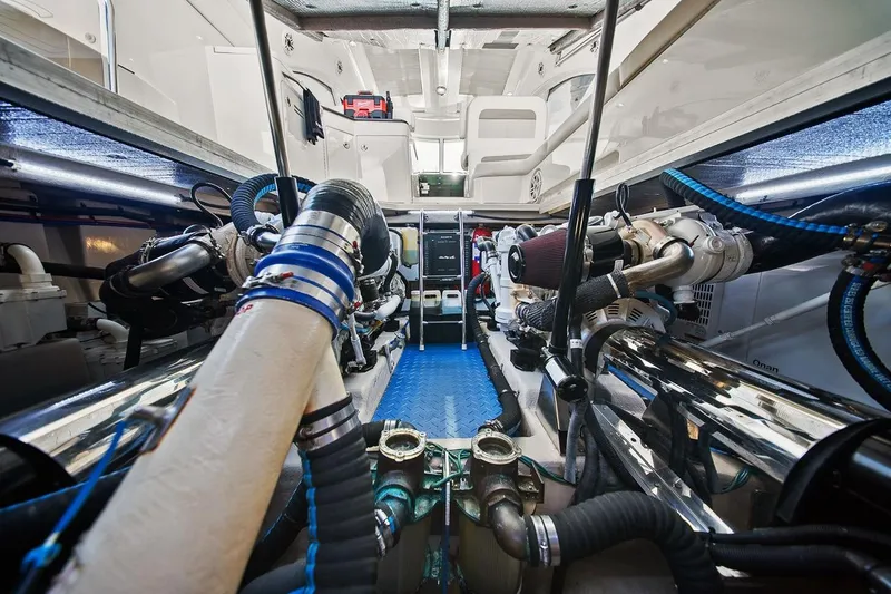 Slide: The Image of Engine room of 2012 Sea Ray 470 Sundancer yacht, showcasing mechanical components and systems. - 10