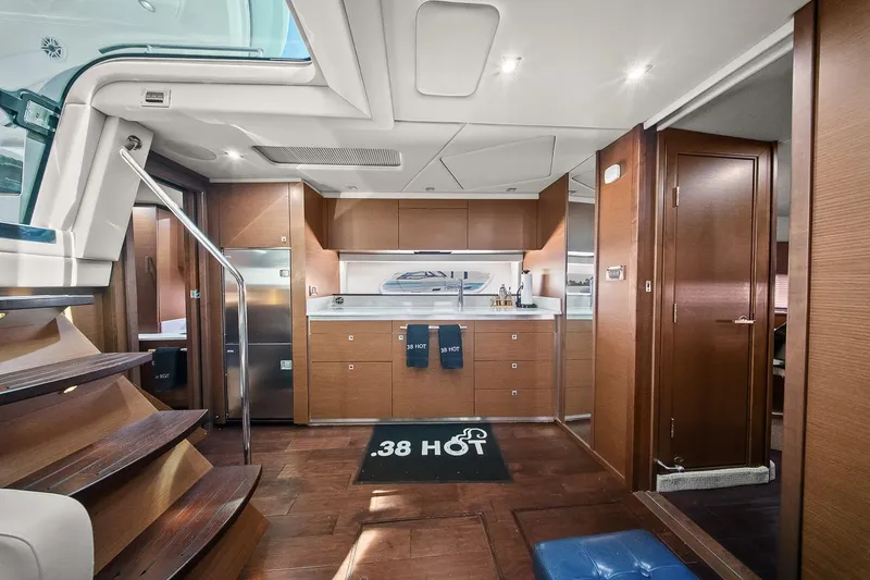 Slide: The Image of Luxurious interior of 2012 Sea Ray 470 Sundancer yacht with modern kitchen and wooden finishes. - 15