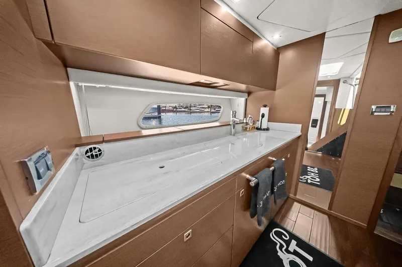 Slide: The Image of Luxurious interior of 2012 Sea Ray 470 Sundancer yacht with sleek countertops and modern design. - 18