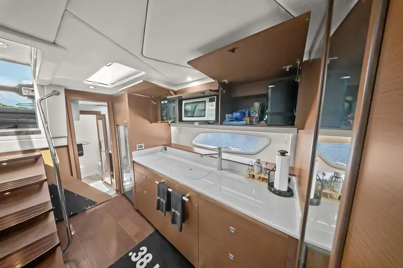 Slide: The Image of Luxurious interior of 2012 Sea Ray 470 Sundancer yacht, featuring modern kitchen amenities. - 19