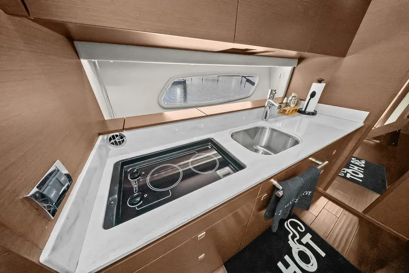 Slide: The Image of Modern galley kitchen in 2012 Sea Ray 470 Sundancer yacht with sleek countertops and appliances. - 20