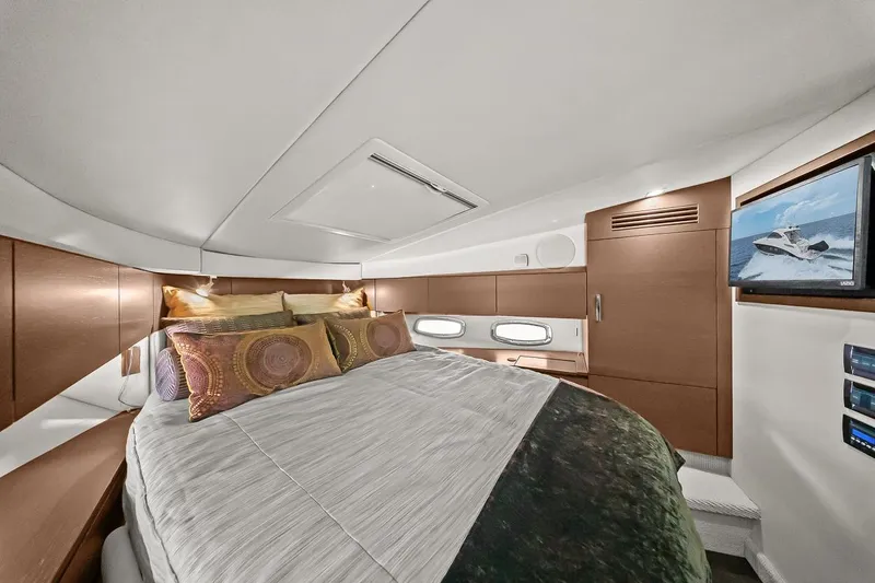 Slide: The Image of Luxurious cabin interior of 2012 Sea Ray 470 Sundancer yacht with cozy bedding. - 23
