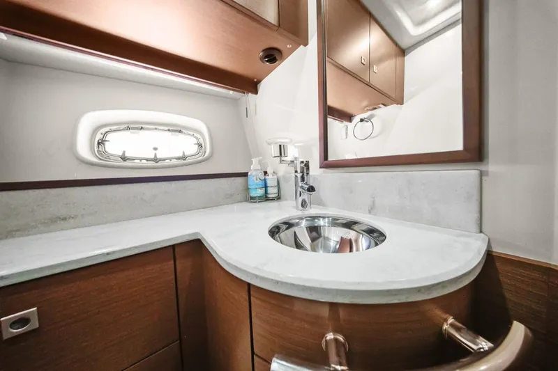 Slide: The Image of Luxurious bathroom interior of 2012 Sea Ray 470 Sundancer yacht with modern fixtures. - 26