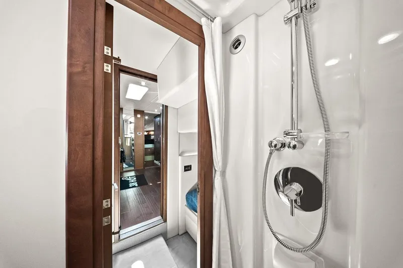 Slide: The Image of Interior of 2012 Sea Ray 470 Sundancer yacht, featuring a modern shower area. - 31