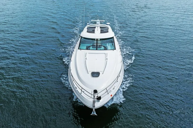 Slide: The Image of 2012 Sea Ray 470 Sundancer yacht cruising on open water. - 36