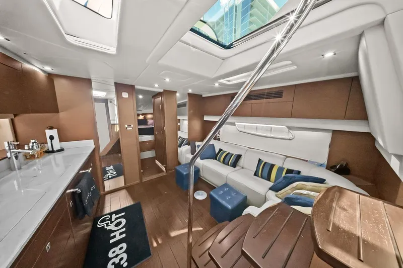 Slide: The Image of Luxurious interior of 2012 Sea Ray 470 Sundancer yacht with modern furnishings and skylight. - 4
