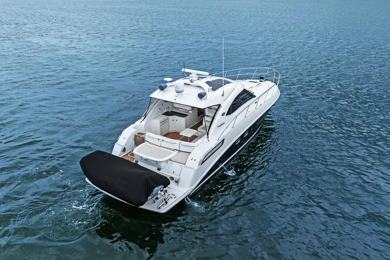 Slide: The Image of 2012 Sea Ray 470 Sundancer yacht cruising on open water. - 40