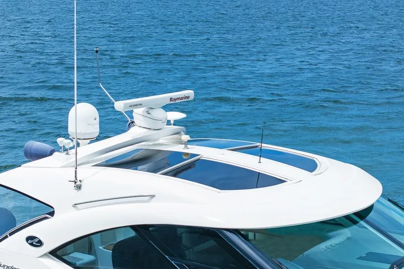 Slide: The Image of 2012 Sea Ray 470 Sundancer yacht with advanced Raymarine radar on open water. - 46