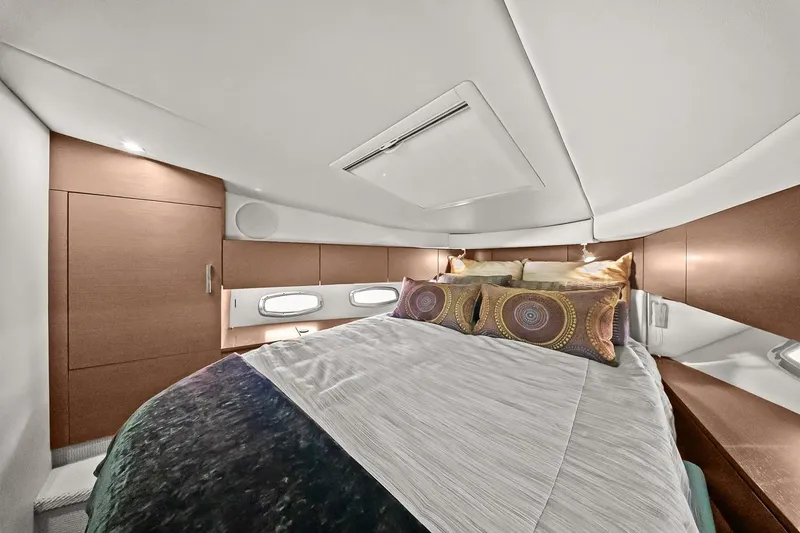 Slide: The Image of Luxurious cabin interior of 2012 Sea Ray 470 Sundancer yacht with elegant bedding. - 5