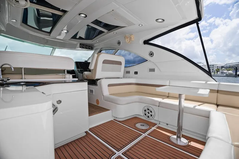 Slide: The Image of Luxurious interior of 2012 Sea Ray 470 Sundancer yacht with elegant seating and modern amenities. - 57