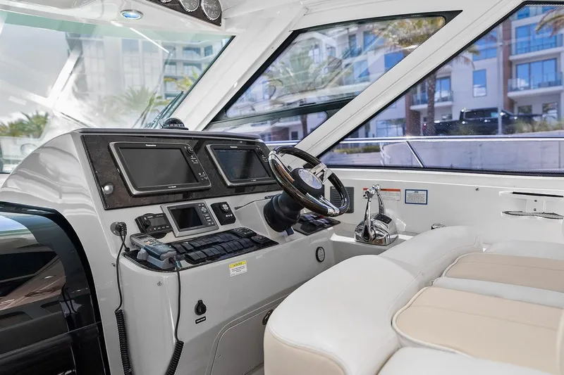 Slide: The Image of Interior helm of 2012 Sea Ray 470 Sundancer yacht with modern navigation equipment. - 58