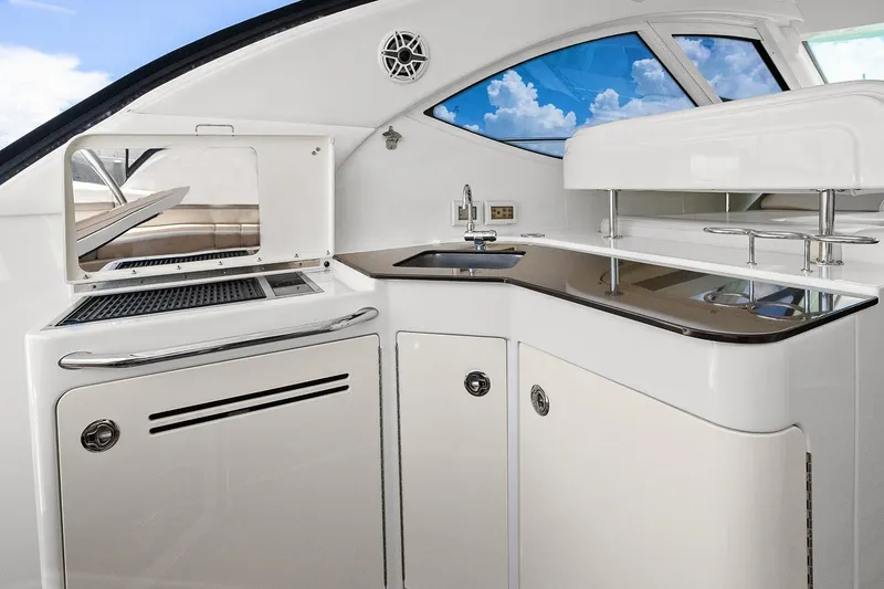 Slide: The Image of Luxurious 2012 Sea Ray 470 Sundancer yacht interior with sleek kitchen area and modern amenities. - 62