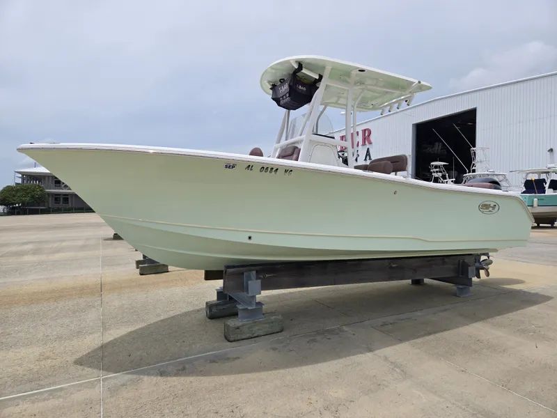 The Image of 2019 Sea Hunt 225 Ultra boat on display at a marina. - 0
