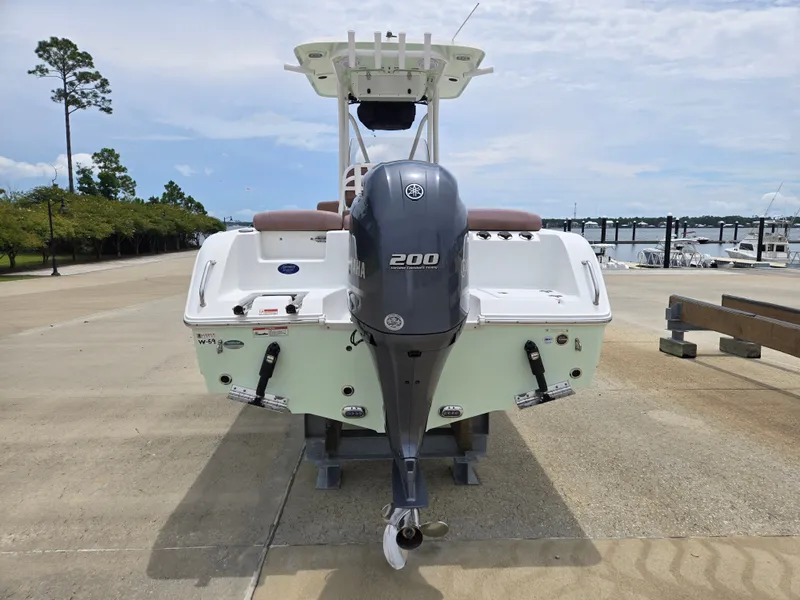Slide: The Image of 2019 Sea Hunt 225 Ultra boat with Yamaha 200 engine at marina dock. - 2