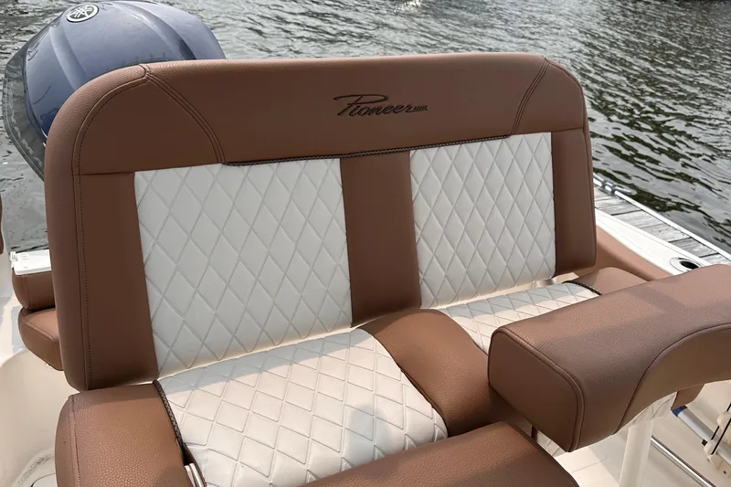Slide: The Image of Luxurious seating on 2024 Pioneer 222 Islander boat with diamond-stitched upholstery. - 14