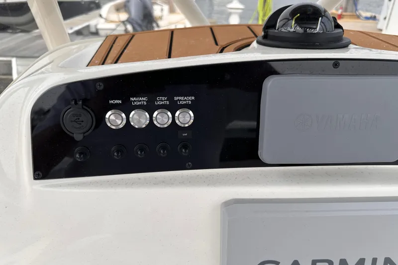 Slide: The Image of Control panel of 2024 Pioneer 222 Islander boat with Yamaha and Garmin components. - 8
