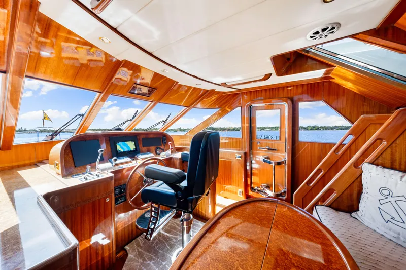 Slide: The Image of Luxurious 2007 Hampton 558 Pilothouse interior with polished wood and scenic water views. - 20