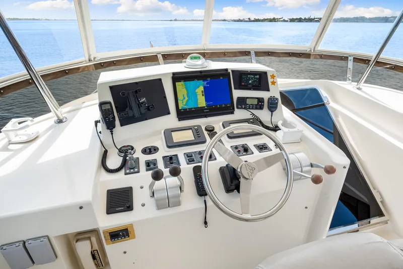 Slide: The Image of Pilothouse of 2007 Hampton 558 yacht with navigation equipment and steering wheel. - 44