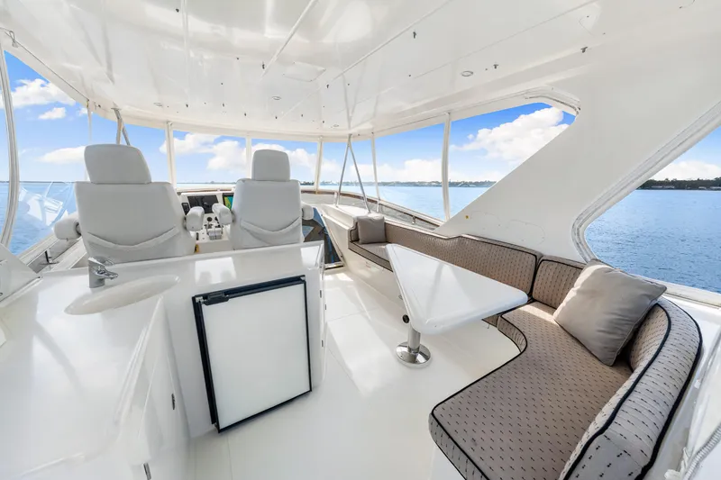 Slide: The Image of Luxurious 2007 Hampton 558 Pilothouse yacht interior with seating and ocean view. - 46