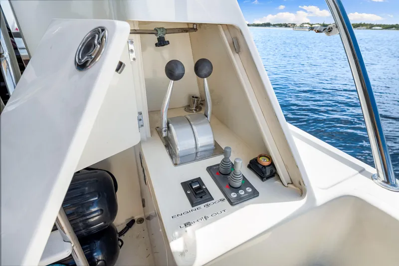 Slide: The Image of Control panel of a 2007 Hampton 558 Pilothouse yacht with scenic water view. - 56