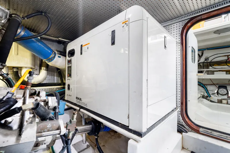 Slide: The Image of Engine room of 2007 Hampton 558 Pilothouse with Kohler power system. - 70