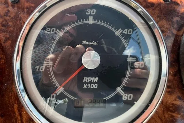 Slide: The Image of Close-up of a Faria RPM gauge on a 2005 Meridian 368 Motoryacht dashboard. - 16
