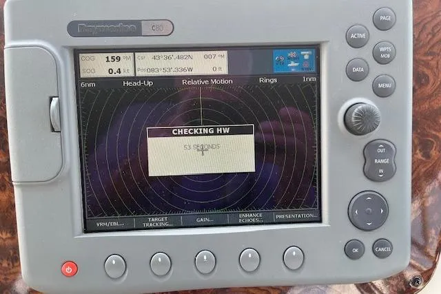 Slide: The Image of Navigation system display on 2005 Meridian 368 Motoryacht, showing radar and coordinates. - 17