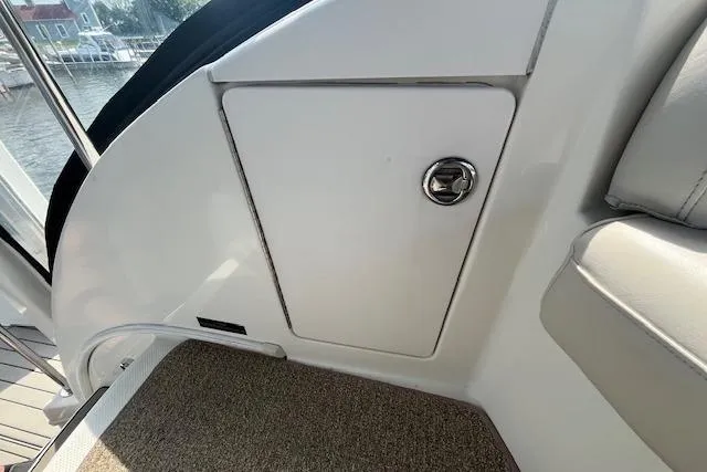 Slide: The Image of 2005 Meridian 368 Motoryacht interior detail with storage compartment and seating. - 25