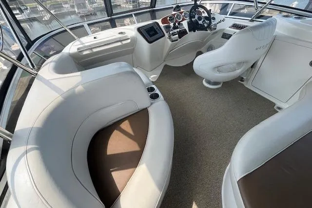 Slide: The Image of 2005 Meridian 368 Motoryacht interior with plush seating and modern helm controls. - 28