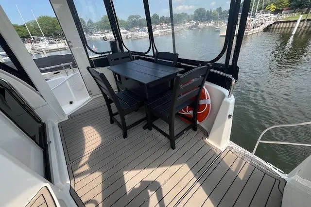 Slide: The Image of 2005 Meridian 368 Motoryacht deck with dining area overlooking marina. - 29